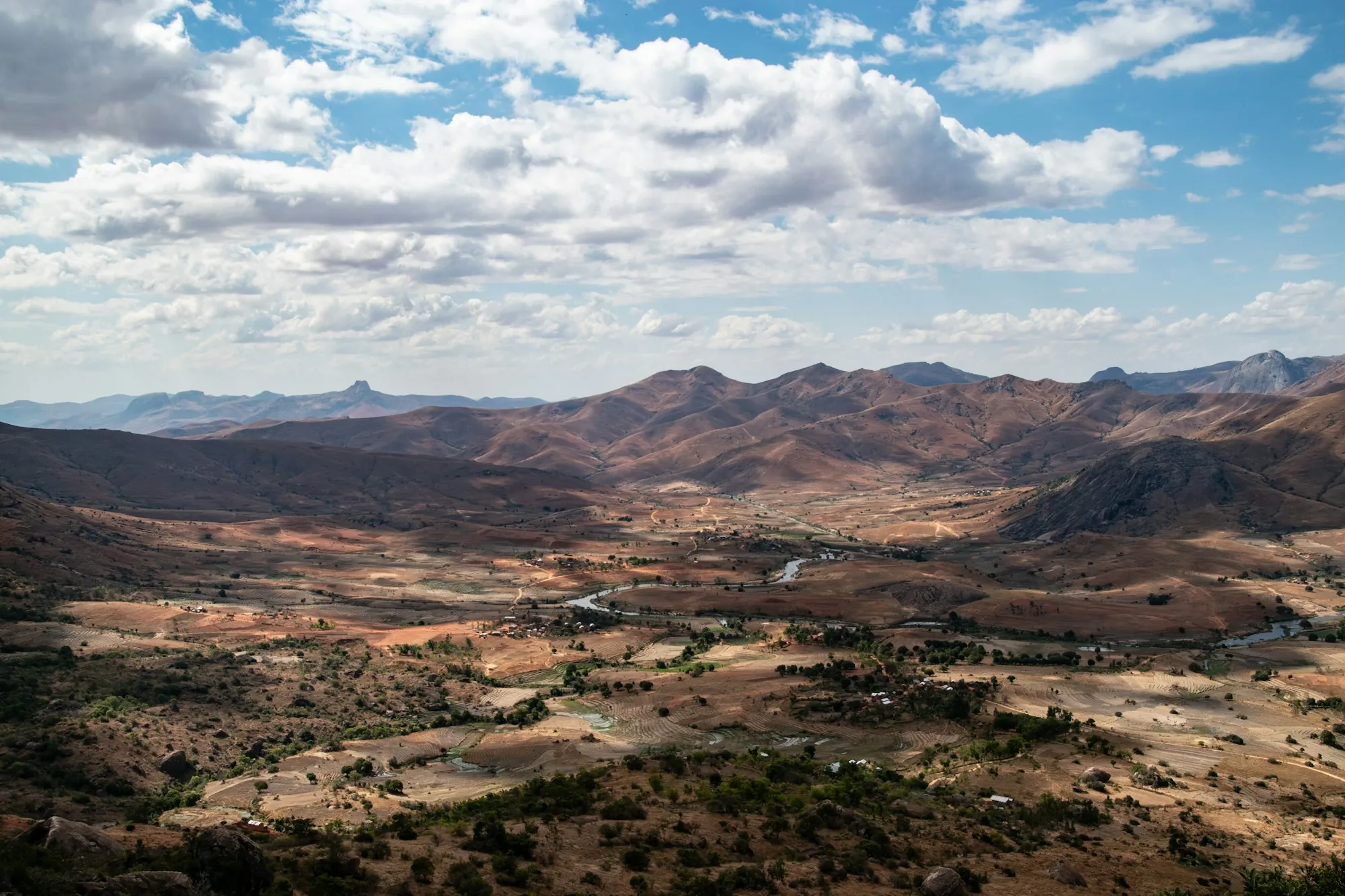 Rugged dry valley with hills and scattered trees