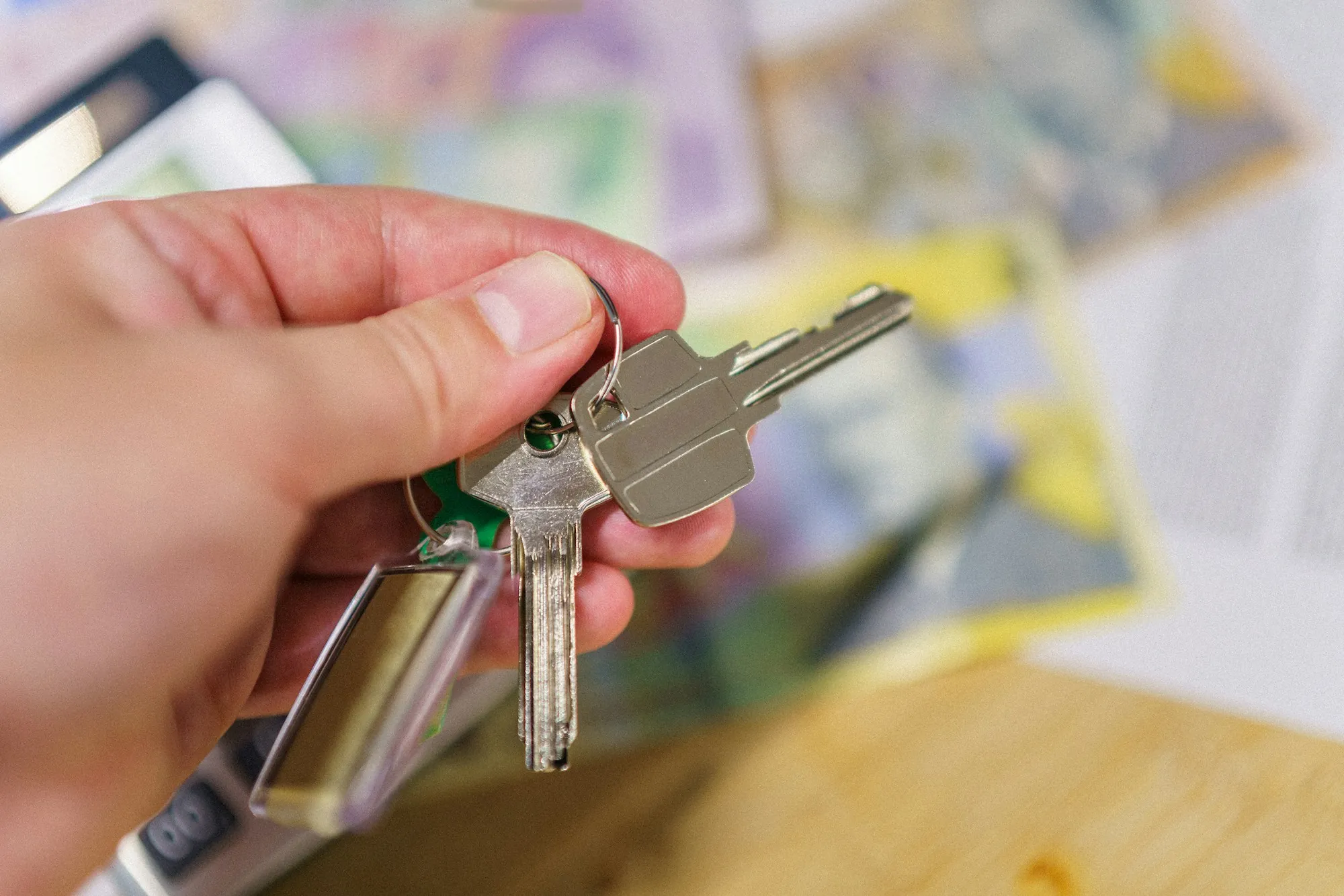 Hand gripping a set of keys close up